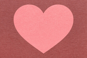 Obraz premium Pink heart on dark maroon paper texture background with copy space for Valentines Day banner, template or greeting card