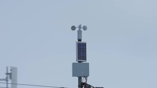 Solar powered weather station anemometer measuring wind speed