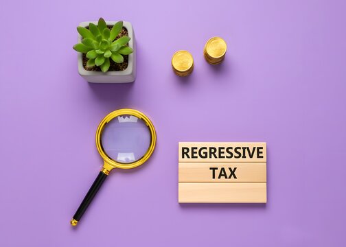 Concept of 'Regressive Tax'. Tax system where the tax rate decreases as the taxpayer's income increases and placing a heavier burden on low-income earners. wooden blocks and coins.