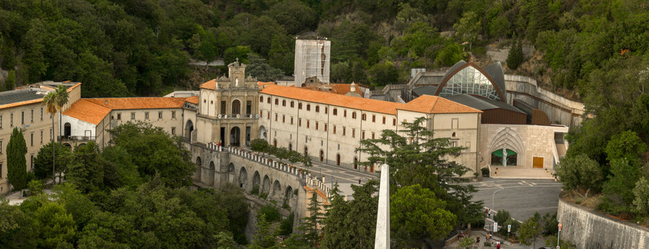 Aerial closeup view of the Catholic sanctuary of San Francesco da Paola, in the province of Cosenza, Calabria, Italy. In front of the basilica is a large square, with the main facade of the church.