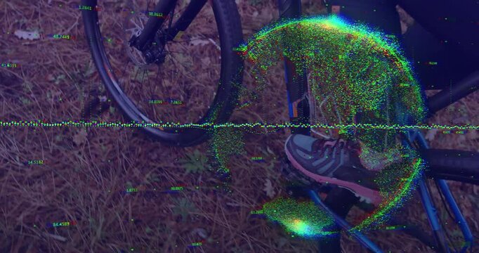 Right foot pressing pedal and foot rising driving blue bike forward over forest floor