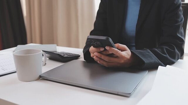 Young casual Businessman holding and using smartphone for sms messages, hipster man typing touchscreen cell phone in the cafe. business, lifestyle, technology and Social media network concept