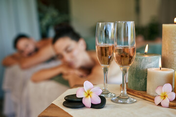 Flutes of champagne at luxury spa while couple relaxing