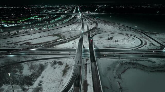 Aerial night view of snowy highways 403 and 407 in Mississauga, Ontario