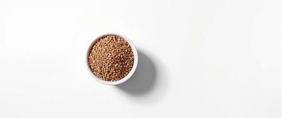 Raw buckwheat served in a bowl, isolated on white from above