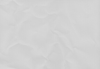 Obraz premium High resolution crumpled white paper texture with visible wrinkles and creases. Abstract vintage paper background suitable for design, templates and overlays.
