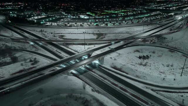 Snowy night aerial of Mississauga highways 403 and 407 in Ontario, Canada