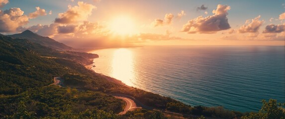Obraz premium Colorful landscape of a coastal road on a summer day, featuring a breathtaking sea view and scenic green mountains during sunset