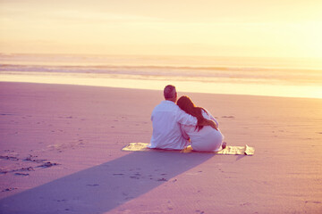 Fototapeta premium Back, mature couple and hug on beach with sunset, connection or summer holiday for bonding together. Married people, embrace and space by ocean with vacation, loyalty or outdoor for romantic getaway.