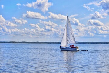 Fototapeta premium A sailing boat sailing on a lake