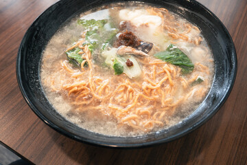Taiwanese pot style noodles, nabeyaki yi mein with egg and vegetables.