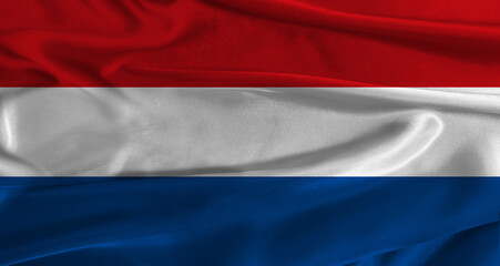 Obraz premium Flag of the Netherlands with fabric textured background. Close up of National flag of the Netherlands with realistic texture