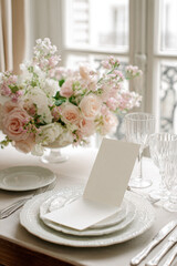 Elegant table setting for wedding celebration with floral centerpiece