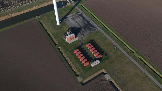 Aerial view of wind turbine base and battery energy storage system