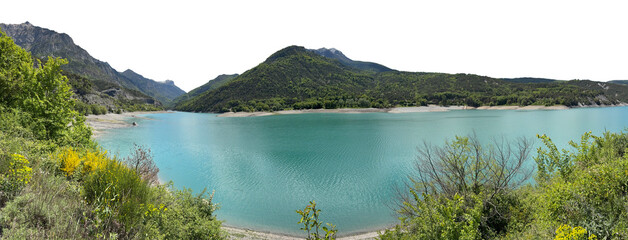 Obraz premium beautiful blue water lake with forest hills wide view landscape in summer. the sky is isolated on white or transparent png