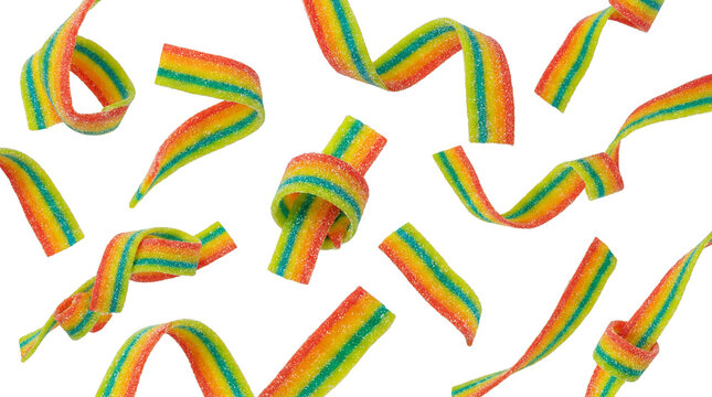 a playful assortment of rainbow sour belt candies in various twisted and knotted shapes, scattered across a transparent background.