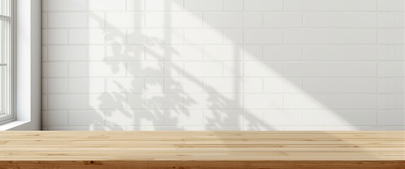 Obraz premium Cozy wooden kitchen table set against a white tile wall with sunlight, window, and leaf shadows, ideal for text design and product display in summer settings