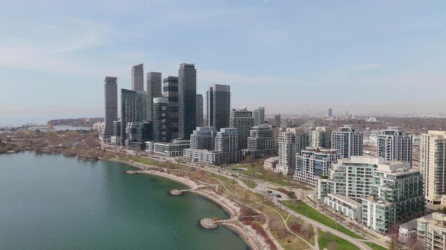 Rising Aerial Shot Of Waterfront Condo Buildings Filling The Parklawn Skyline On Lake Ontario, Toronto.