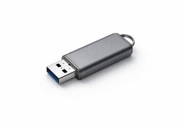 Compact gray USB memory stick for storing files on a white minimal background