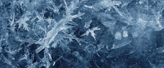 Fototapeta premium Detailed view of ice formations and frost crystals on a frozen water surface highlighting winter textures