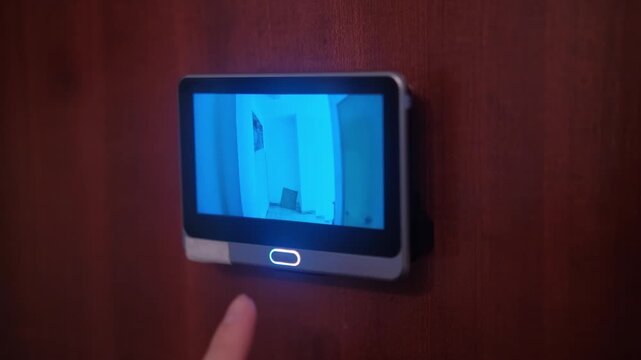Front door peephole security camera detecting movement. Technology and home secure system concept. 