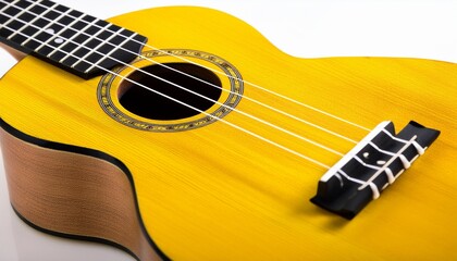 vibrant yellow ukulele with black strings and fretboard
