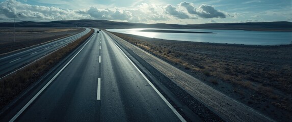Obraz premium Close-up horizontal view of new asphalt road, showcasing the texture of the tarmac in an urban setting