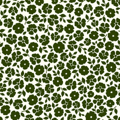 Seamless green floral pattern with small flowers and leaves. Ditsy floral pattern. Vector seamless print