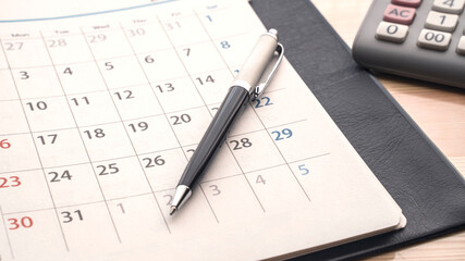 pen on a agenda on the table