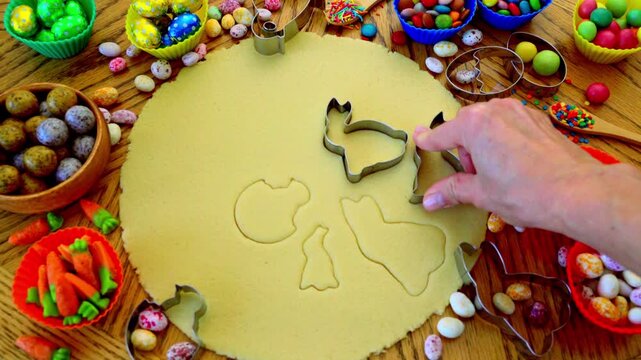 Easter cookie crafting involves creating festive treats by cutting shortcrust dough into traditional shapes like bunnies, eggs, and chicks using special cookie cutters, following detailed traditional 