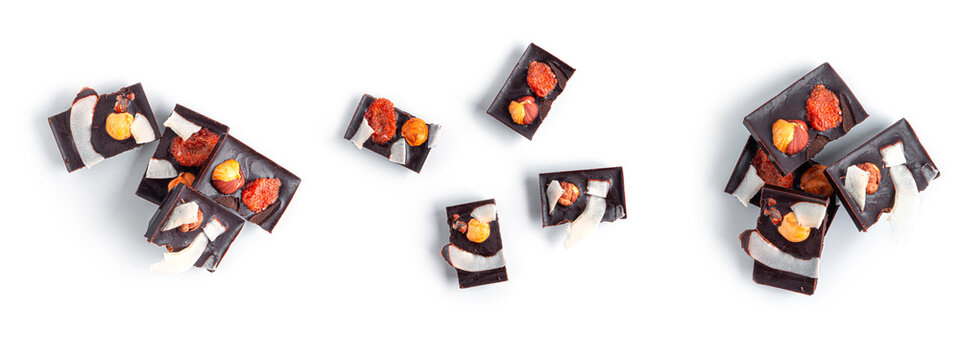 Raw chocolate with dried fruits and nuts on a white background. High quality photo
