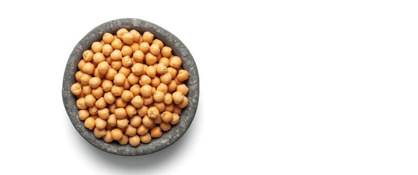 Close-up of organic chickpeas (Bengal Gram) in rock bowl on white background, top view for banner and design, Cicer arietinum