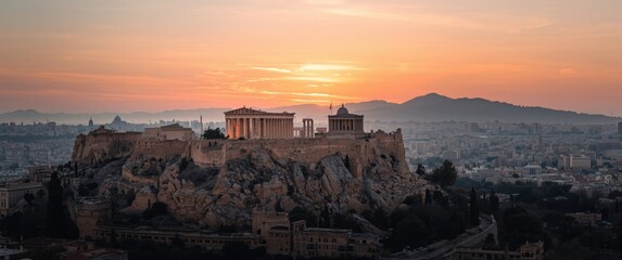 Fototapeta premium Sunset Drone Shot of Athens' Acropolis with Parthenon, Hekatompedon Temple, Zeus Polieus Sanctuary, Odeon of Herodes Atticus, and Erechtheion