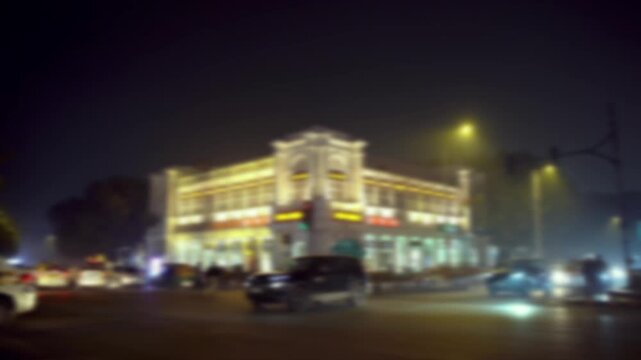 Blurred Night View of Connaught Place, New Delhi, India with Illuminated Buildings background