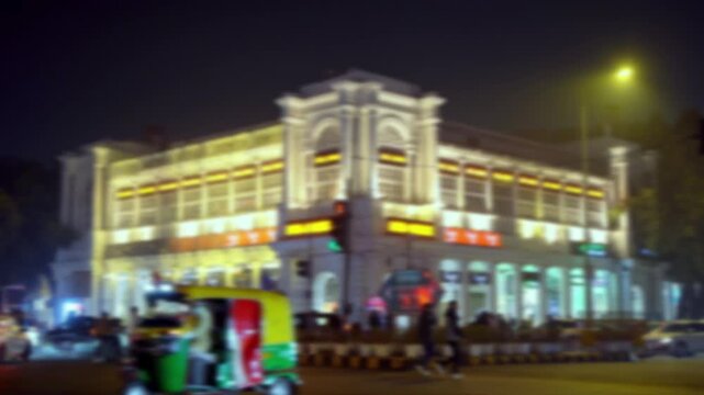 Blurred Night View of Connaught Place, New Delhi, India with Illuminated Buildings background