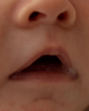 Baby mouth with spit bubbles