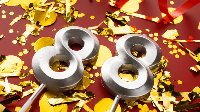 Number 88 celebration birthday digit on Red festive with confetti background. eighty-eight year birthday. concept of birthday, anniversary and date.
