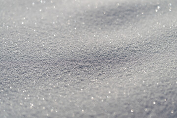 Obraz premium Crystalline snow grains with intense reflective gleam highcontrast macro texture, sparkling highlights for minimalist design or scientific reference, tactile visual interest