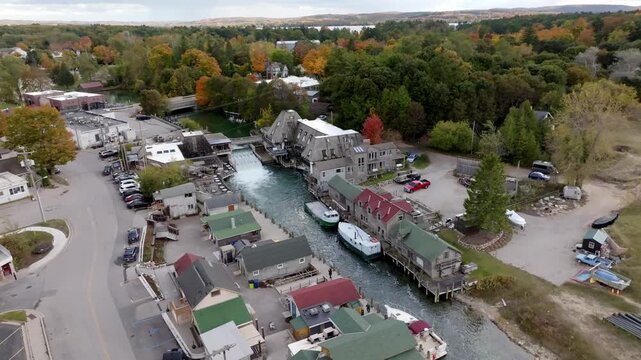 Historic Fishtown in Leland, Michigan on a fall day with drone video moving in a circle.