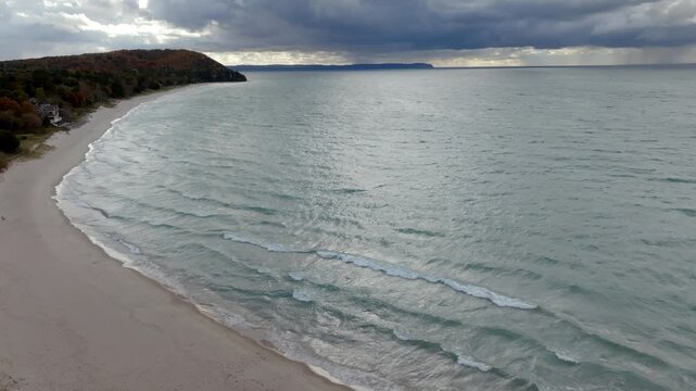 Lake Michigan shoreline in Leland, Michigan on a fall day with stable drone video.