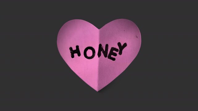 A stop motion style peeling paper sticker with cheeky caption in the shape of a love heart with alpha for easy overlay and drag and drop.