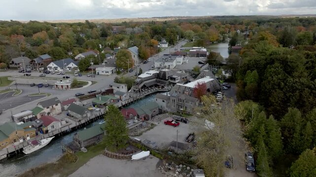 Historic Fishtown in Leland, Michigan on a fall day with drone video moving in.