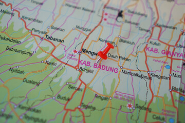 Naklejka premium view of Badung Regency, Bali Island, Indonesia on a geographical map, marked with a red pin 