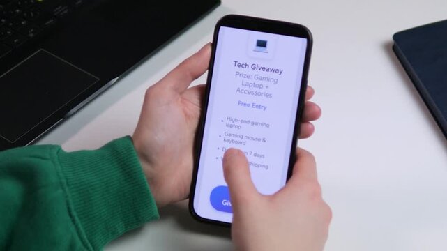 Close-up of hands entering a tech giveaway for a gaming laptop bundle. User clicking the Enter button. Perfect for social media marketing, influencer promotions, and digital sweepstakes content