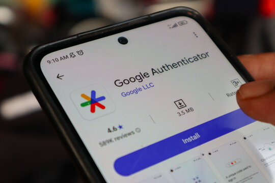 Hand installing Google Authenticator at Android smartphone. Depok, Indonesia 20 August 2025