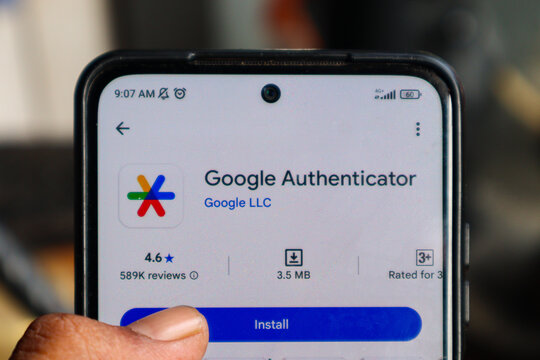 Hand installing Google Authenticator at Android smartphone. Depok, Indonesia 20 August 2025