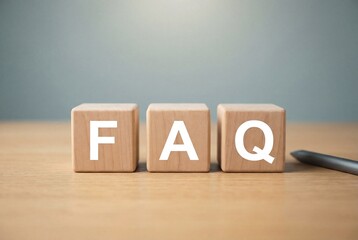 Wooden blocks spelling FAQ for customer support questions