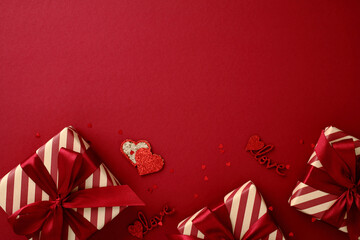 Valentine's Day concept with gift boxes and confetti on a red paper background