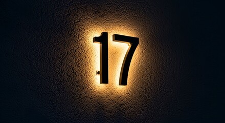 Modern Backlit House Number 17 on Dark Textured Wall Background