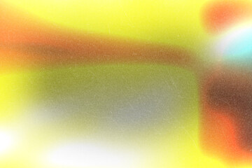 Dynamic abstract color gradient with vibrant hues and a soft vintage film grain texture